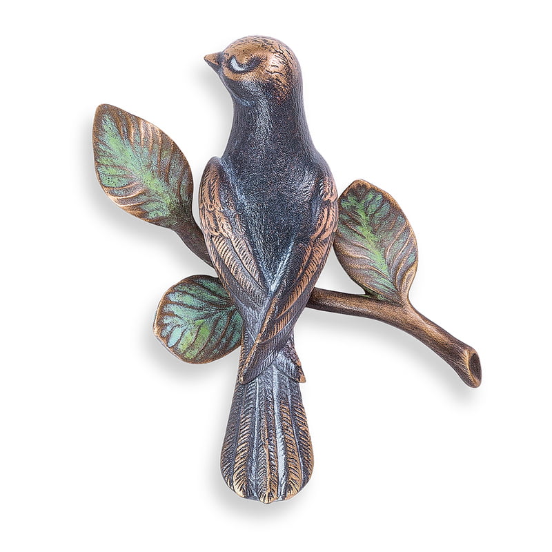 Bronzen vogel op tak